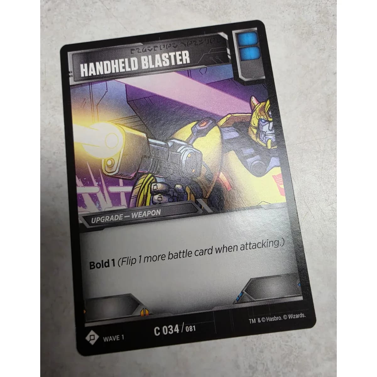 Handheld Blaster 034/081 - Transformers TCG Wave 1